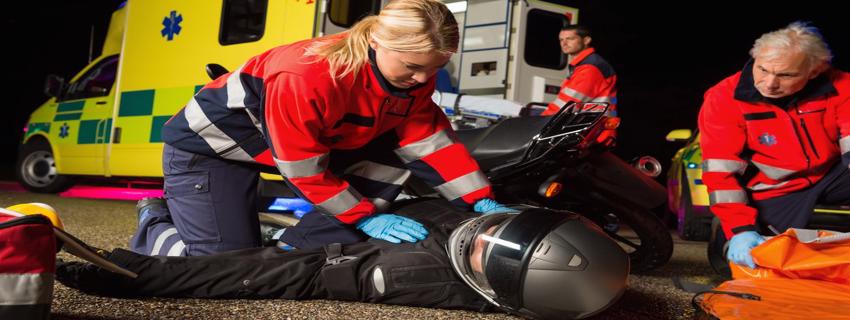 EMS coming to the aid of a man after a motorcycle accident in Atlanta, Georgia